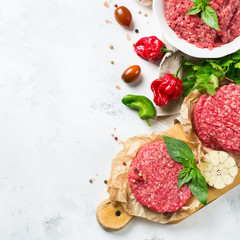 Homemade raw organic minced beef meat burger cutlet and vegetables