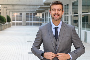 Elegant businessman adjusting his suit