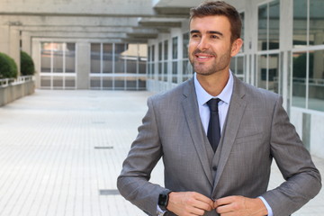 Elegant businessman adjusting his suit