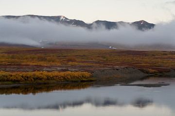 The river and the cloud at the foot of the mountains. Polar Urals. The Republic Of Komi. Russia.