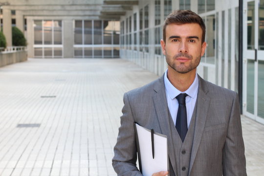 Cute businessman dressed to impress with copy space