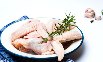 Raw chicken wings with rosemary