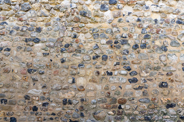 Background old brickwork with stones of different color
