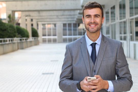 Good looking businessman isolated in office space