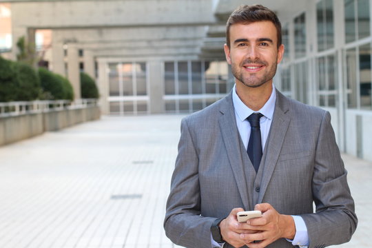 Cute businessman dressed to impress with copy space