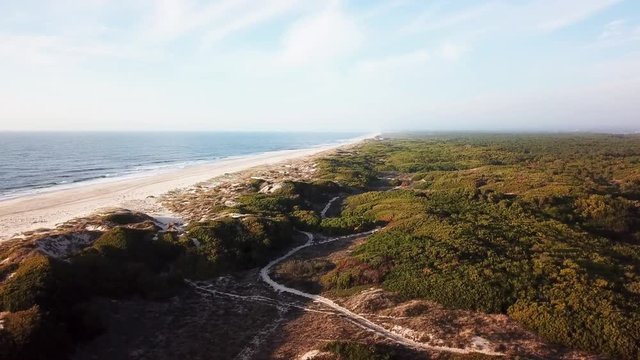 Aerial view of beach and sand dunes at sunset in Murtosa, Aveiro - Portugal. Aerial view.
