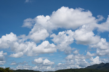 blue sky with white fluffy clouds