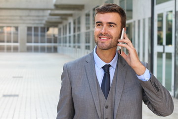 Businessman listening on the phone with enthusiasm