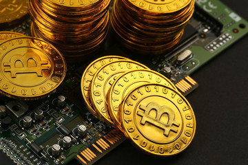 golden bitcoins on circuit board