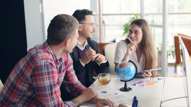 office workers with a globe. international business theme