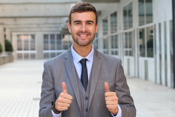 Businessman showing a double thumbs up 