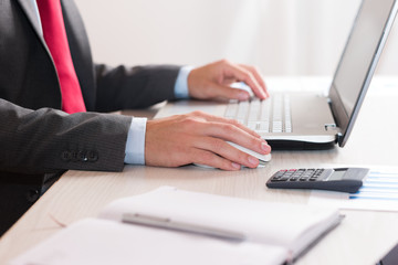 Businessman working on a computer in his office