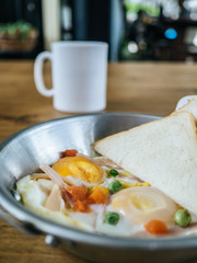 Breakfast set of fried egg and breads.
