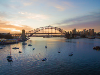 Aerial drone view of sunrise at Sydney Harbour Bridge - obrazy, fototapety, plakaty