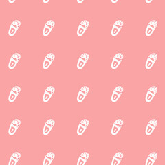 Vector seamless pattern with little boots on pink backdrop. Illustration of shoes. Can be used as print on T-shirt, wrapping paper, web. EPS10.