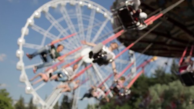 Amusement Park, People Ride the Carousel