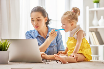 mother with toddler working