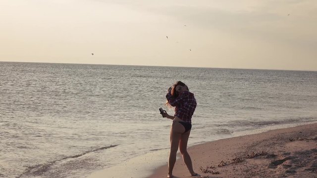 Girl on beach with phone