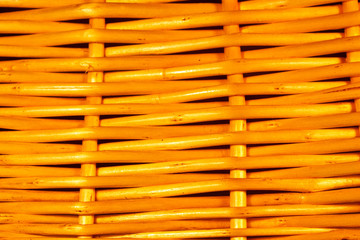 A closeup view of a wicker basket, with linear lines.