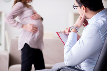 Pregnant woman visiting psychologist doctor