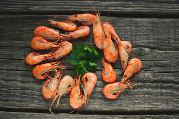 On a wooden table beautifully arranged shrimp