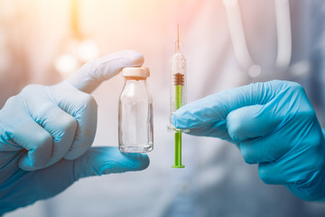 Syringe, medical injection in hand. Vaccination equipment.