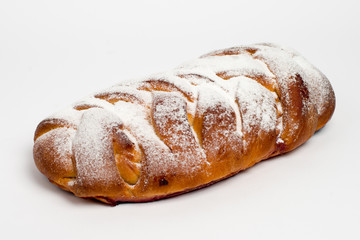Sweet cinnamon bun roll swirl isolated over the white background