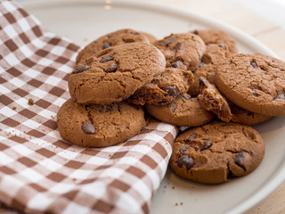 Chocolate cookies on a scott fabric napkin in a dish