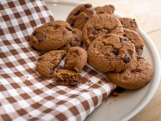 Chocolate cookies on a scott fabric napkin in a dish