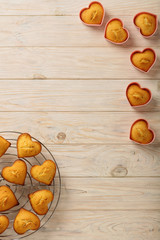 Cupcakes hearts in silicone forms of pink color.