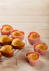 Cupcakes hearts in silicone forms of pink color.
