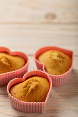 Cupcakes hearts in silicone forms of pink color.