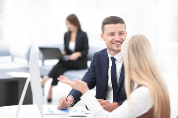 Manager talking with a colleague at the workplace