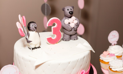 Happy birthday cake with number 3 pink on white tabel