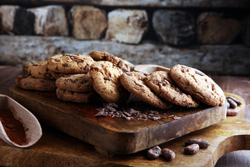 Chocolate cookies on wooden table. Chocolate chip cookies shot