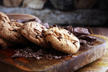 Chocolate cookies on wooden table. Chocolate chip cookies shot