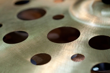 thin metal surface with rhythmic apertures