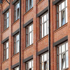 Obraz premium facade of a brick office building in the old style