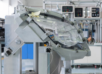 testing automobile headlights to comply with the standard. close-up factory equipment of quality control of automobile headlight