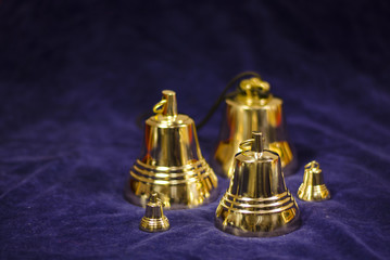 Fototapeta na wymiar Copper bells on a blue background