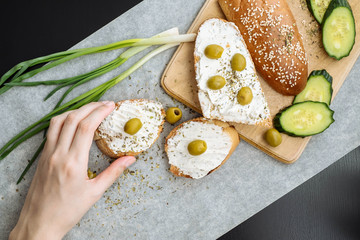 Making sandwiches with pickles and olives healthy organic food