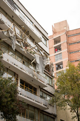 Heavily damaged building after an earthquake
