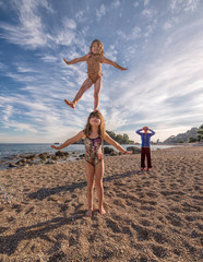 Little girls playing on the beach