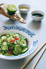Thai cucumber salad with sesame and chili, dressing for salad, Asian cuisine