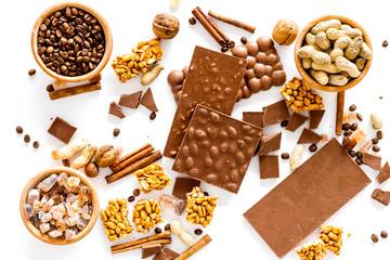 Ingredients for chocolates on white background top view