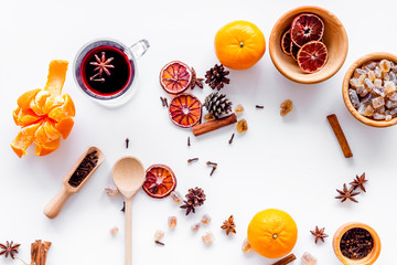 Merry christmas in winter evening with warm drink. Hot mulled wine or grog with fruits and spices...
