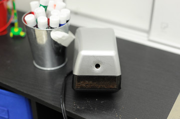 Pencil sharpener in the school on the desk
