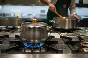 A chef  cooking in the stove