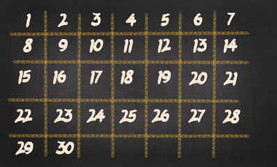 Monthly Calendar with 30 days on chalkboard background