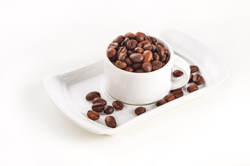 White cup and coffee beans